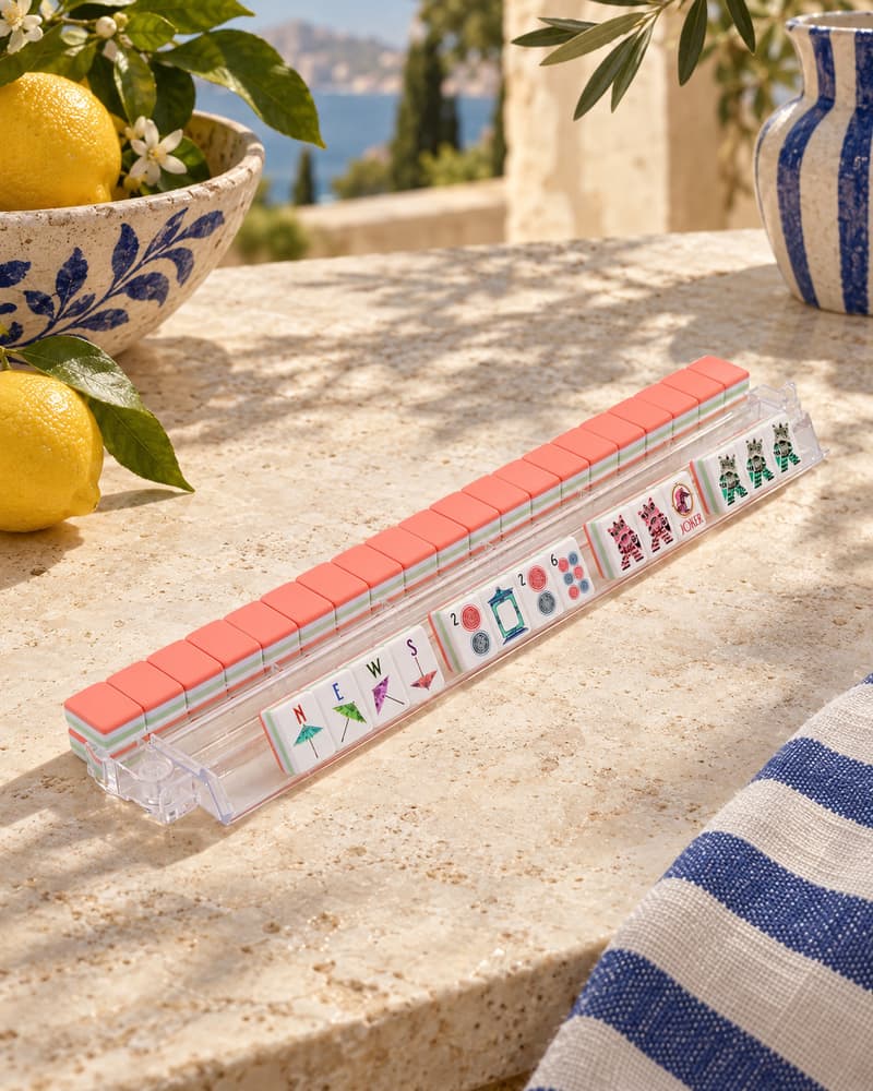 Sorrento Set tiles with coral backs standing in an acrylic rack by the sea